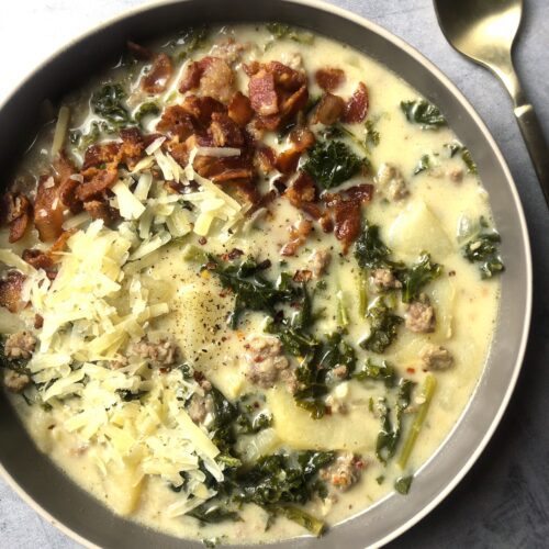 bowl of zuppa toscana with spoon