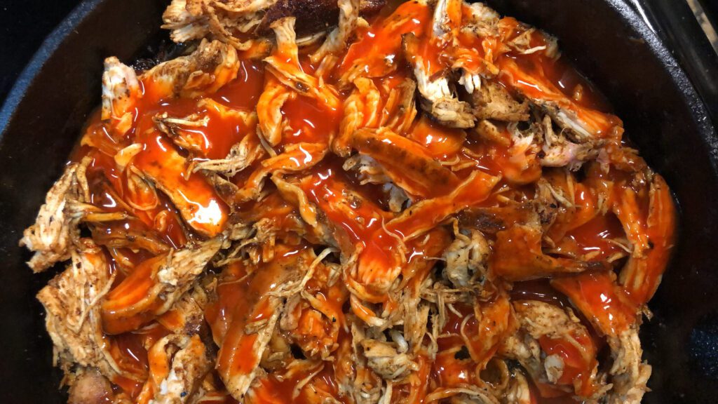 shredded chicken and hot sauce for buffalo chicken dip
