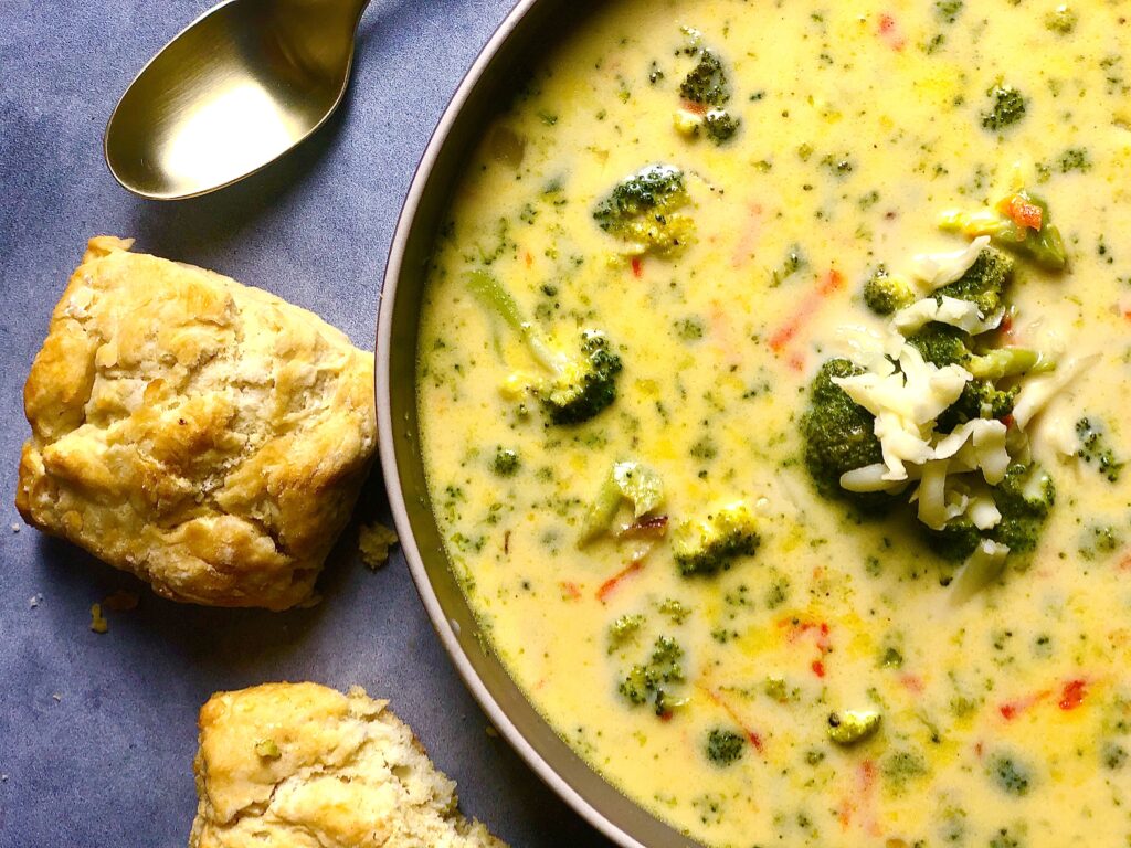 broccoli cheddar soup closeup overhead with biscuits