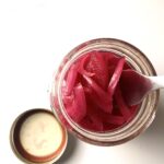 overhead view of jar of pickled red onions