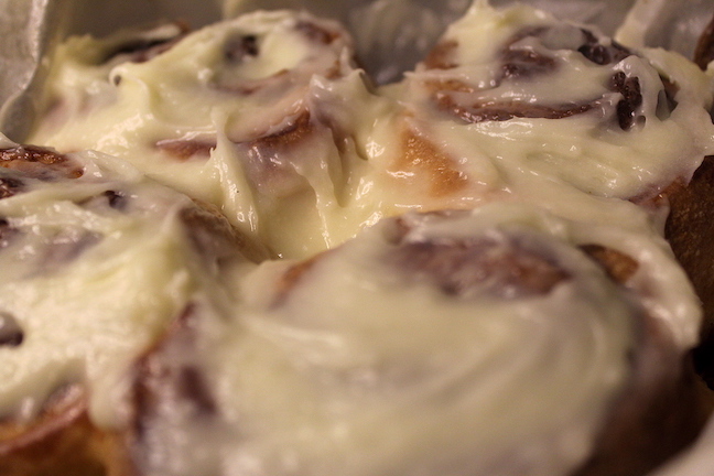 cinnamon rolls topped with cream cheese frosting