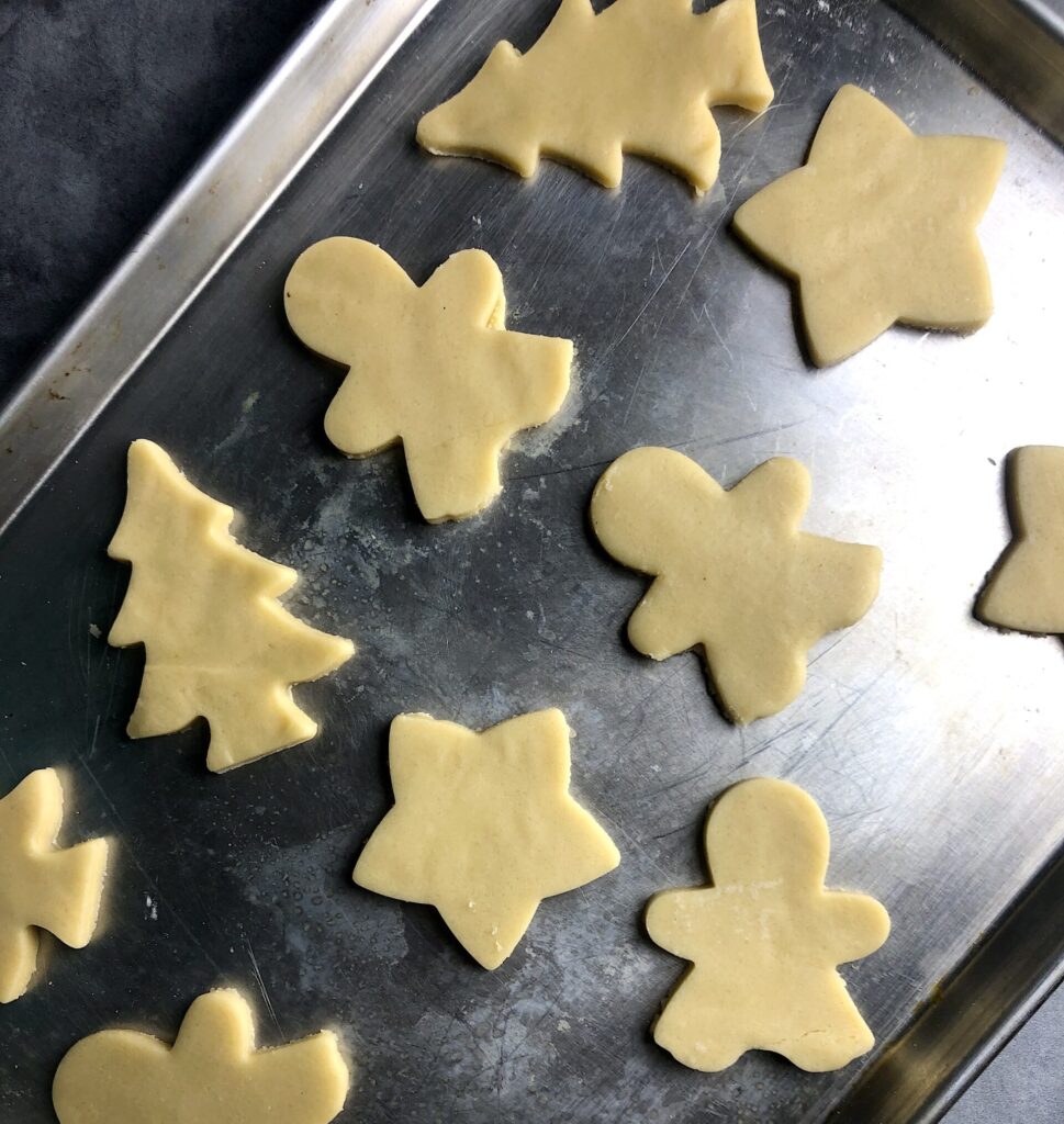 sugar cookie dough cut into shapes
