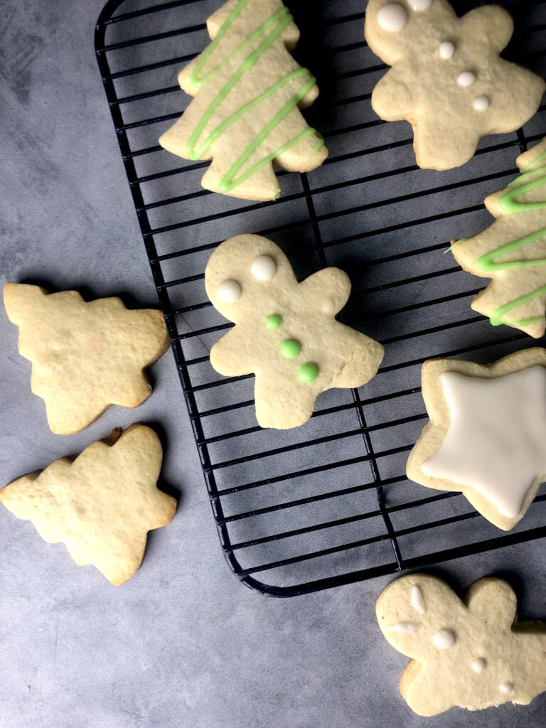 cut out sugar cookies decorated on rack