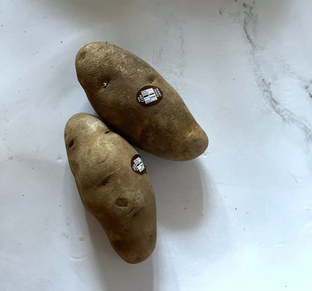 russet potatoes on white countertop