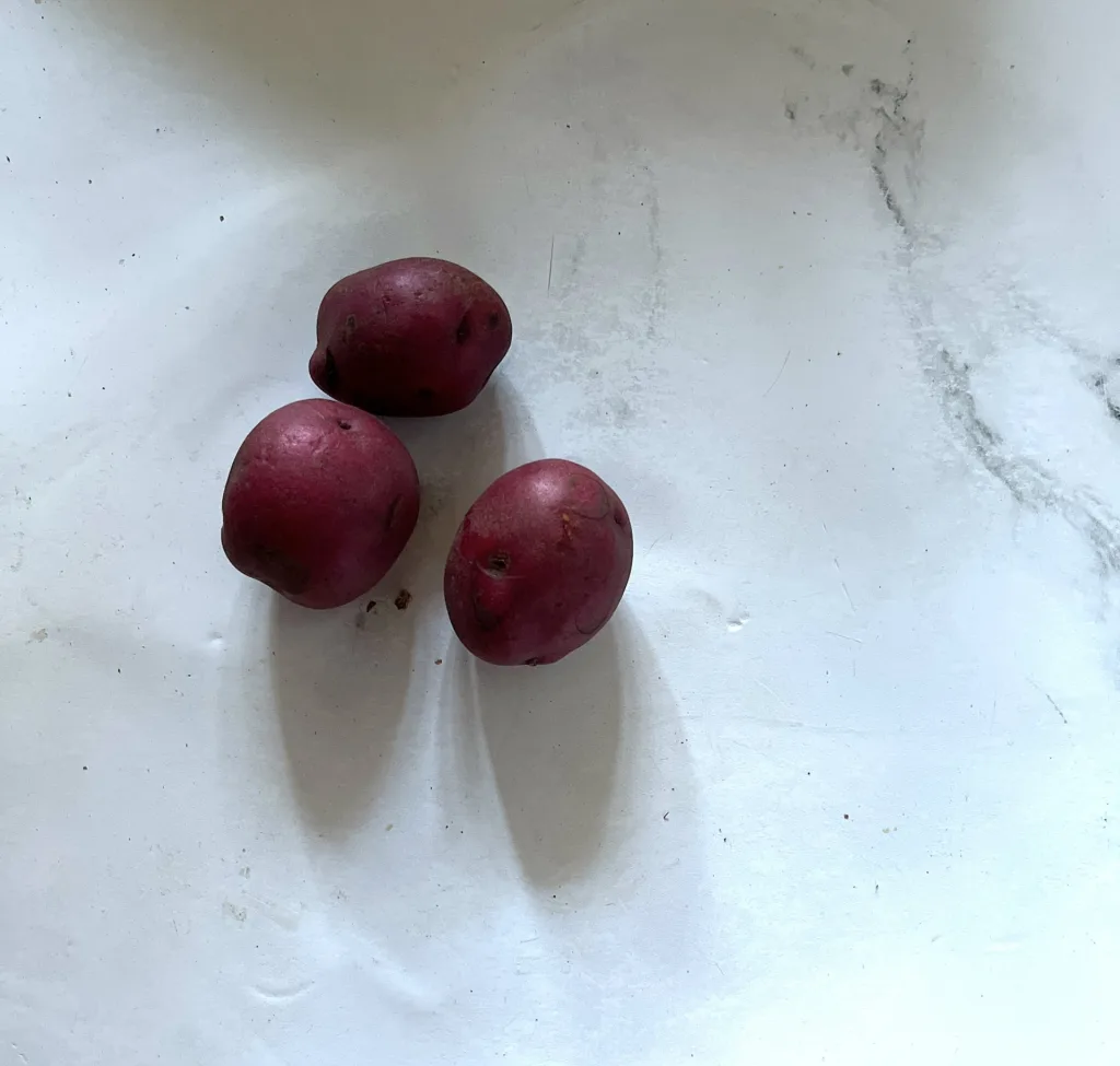 red potatoes on white countertop