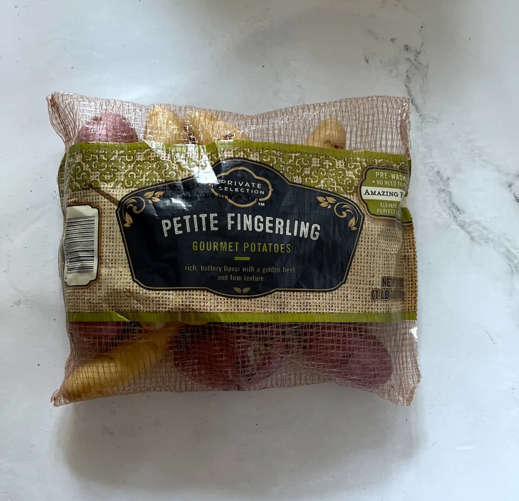 the front of petite fingerling potato package on white countertop