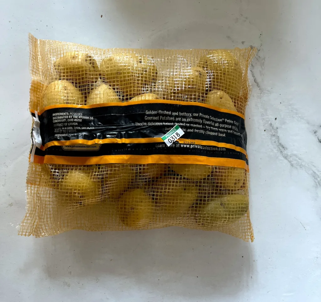the back of the petite yukon gold potato package on white countertop