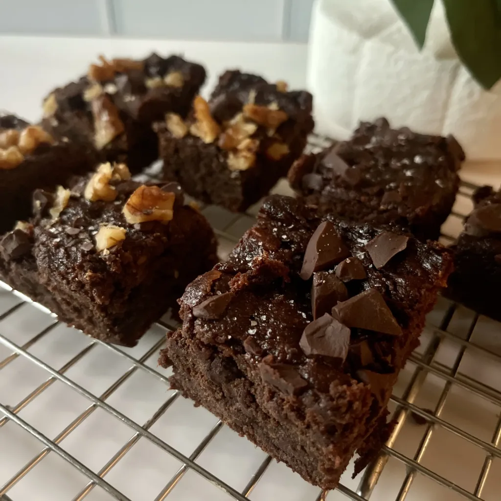 sweet potato brownies - plain and with walnuts - close-up on metal cooling rack