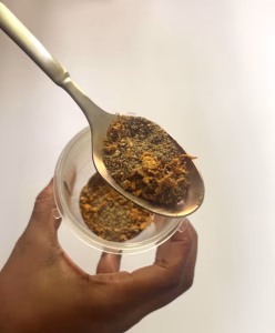 coarse grapefruit pepper on a spoon